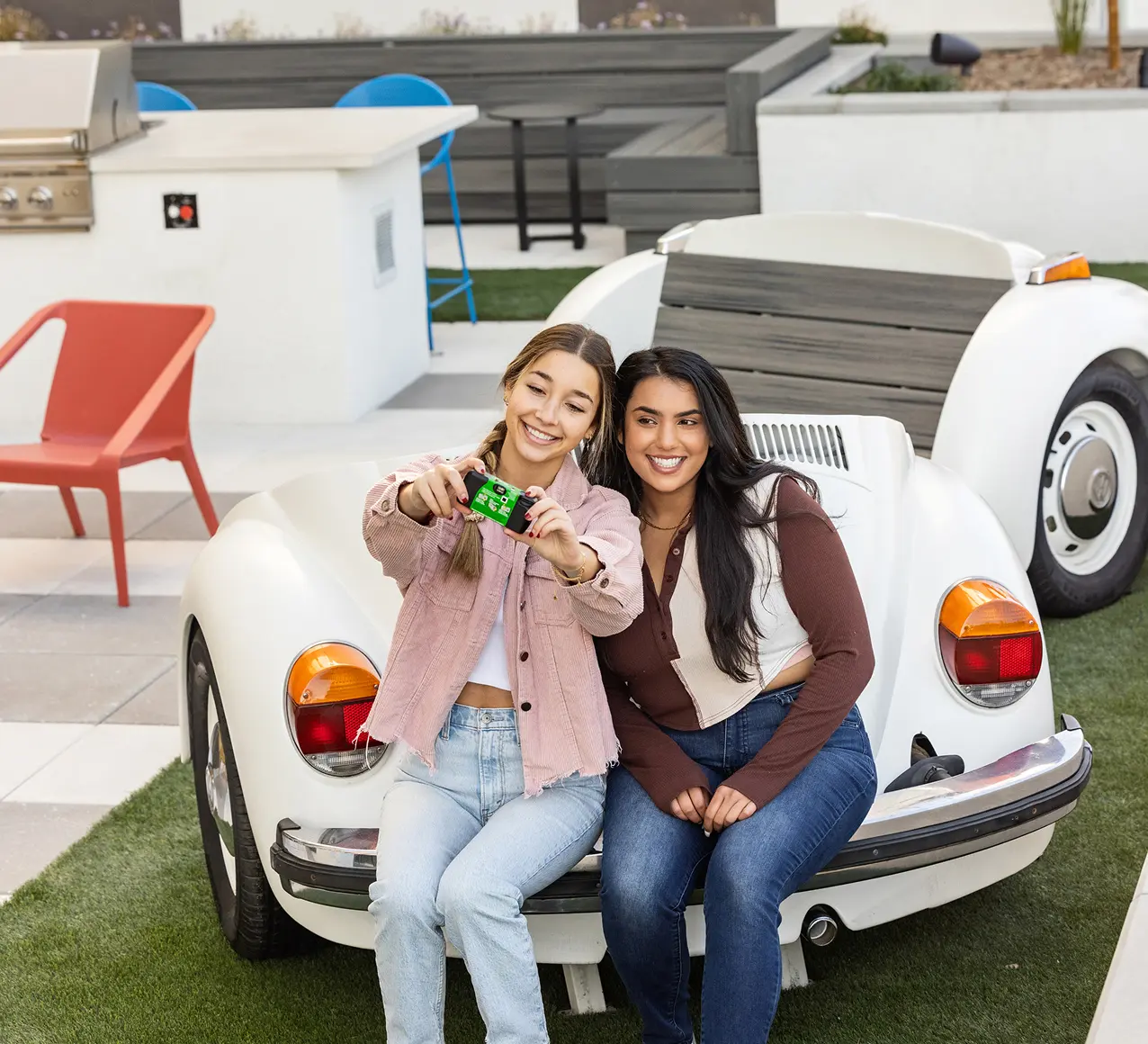 two young women taking a photos