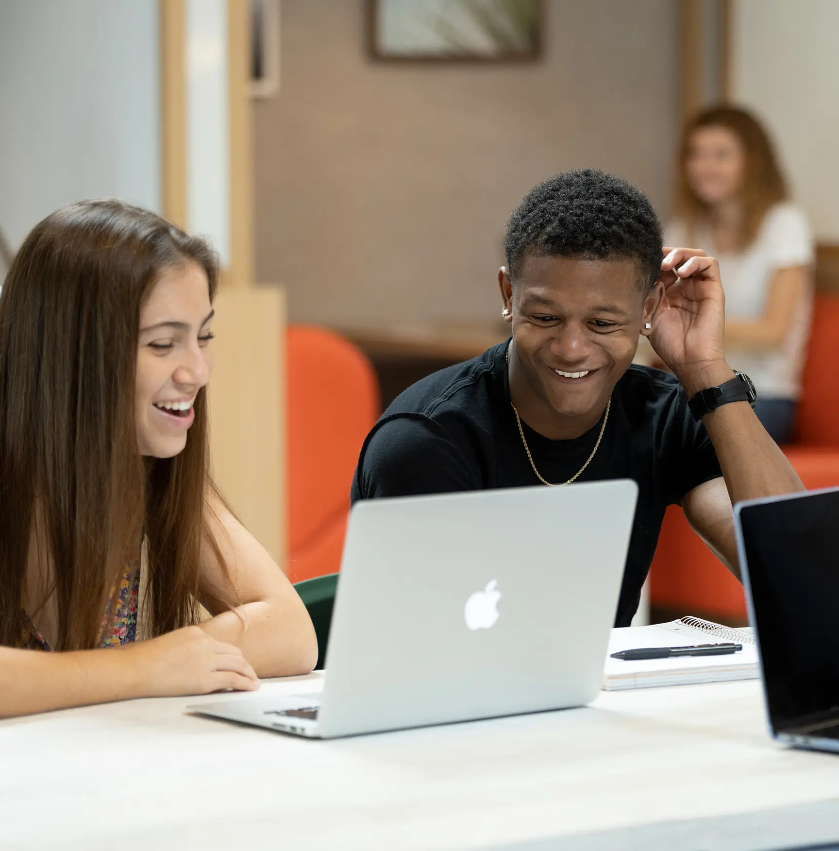 people using a laptop