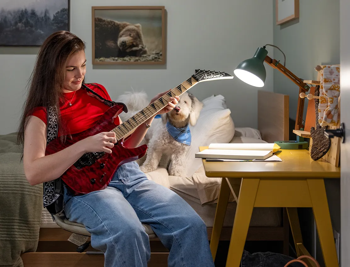 a woman playing the guitar